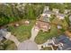 Aerial view of the property showing a large yard, pool, house and garden at 48 Falling Oak Ct, Clayton, NC 27520