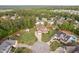 Wide aerial view of the house, backyard, pool, garden and surrounding neighborhood at 48 Falling Oak Ct, Clayton, NC 27520