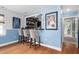 Charming bar area featuring custom shelving, comfortable seating, and Carolina Tarheels memorabilia at 48 Falling Oak Ct, Clayton, NC 27520