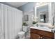 Charming bathroom with paneled walls and decorative accents at 48 Falling Oak Ct, Clayton, NC 27520