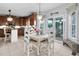 Charming dining area with unique chairs, chandelier, and sliding glass doors to the backyard at 48 Falling Oak Ct, Clayton, NC 27520