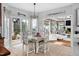 Bright dining area with stylish decor, views of the living room, and easy access to the outdoors at 48 Falling Oak Ct, Clayton, NC 27520