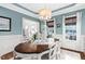 Cozy dining room featuring large windows, hardwood floors, and classic decor at 48 Falling Oak Ct, Clayton, NC 27520