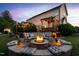 Outdoor fire pit area with comfortable seating, perfect for evening gatherings and relaxation at 48 Falling Oak Ct, Clayton, NC 27520