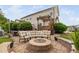 Cozy fire pit area with an outdoor kitchen, perfect for entertaining and relaxation at 48 Falling Oak Ct, Clayton, NC 27520