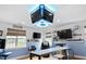 Entertainment room featuring a Tarheels theme, multiple televisions, and comfortable seating options at 48 Falling Oak Ct, Clayton, NC 27520