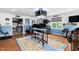Spacious game room with multiple TVs, Carolina Tarheels decor, and custom seating arrangements at 48 Falling Oak Ct, Clayton, NC 27520