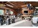 Spacious garage with exposed wood ceiling, storage, work bench and epoxy floor at 48 Falling Oak Ct, Clayton, NC 27520