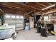 Bright garage with garage door, epoxy floor and storage at 48 Falling Oak Ct, Clayton, NC 27520