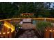 Cozy garden with a pergola swing and festive lighting at 48 Falling Oak Ct, Clayton, NC 27520