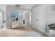 Bright hallway leading to bedrooms featuring white trim and neutral decor at 48 Falling Oak Ct, Clayton, NC 27520