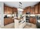 A chef's kitchen featuring custom cabinets, stainless steel appliances, and a wooden island with abundant storage at 48 Falling Oak Ct, Clayton, NC 27520