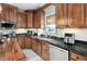 This home boasts a spacious kitchen with custom cabinets, stainless-steel appliances, and lots of countertop space at 48 Falling Oak Ct, Clayton, NC 27520