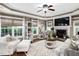 Cozy living room with fireplace, large windows, and neutral decor for a relaxing atmosphere at 48 Falling Oak Ct, Clayton, NC 27520
