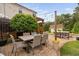 Outdoor dining area with seating for six, complemented by elegant patio furniture at 48 Falling Oak Ct, Clayton, NC 27520
