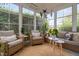 Comfortable sunroom with lots of windows, providing abundant natural light and scenic views at 48 Falling Oak Ct, Clayton, NC 27520