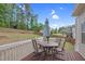 Back deck with table, umbrella, and seating at 5004 Clowser Minnow Ct, Wake Forest, NC 27587