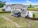 Aerial view of a spacious backyard featuring a screened porch and wooden fence for privacy and outdoor activities at 5004 Clowser Minnow Ct, Wake Forest, NC 27587