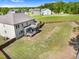 Large backyard featuring a wooden fence, a screened porch, and ample space for outdoor recreation and entertainment at 5004 Clowser Minnow Ct, Wake Forest, NC 27587