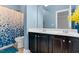 This bathroom has blue walls, a dual sink vanity and shower and tub combo at 5004 Clowser Minnow Ct, Wake Forest, NC 27587