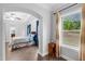Bright bedroom showcasing hard wood floors, ceiling fan, and large window letting in natural light at 5004 Clowser Minnow Ct, Wake Forest, NC 27587