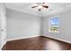 Spacious bedroom with hardwood flooring, crown molding and a large window with a view at 5004 Clowser Minnow Ct, Wake Forest, NC 27587