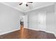 Spacious bedroom with hardwood floors, a ceiling fan, and access to another room at 5004 Clowser Minnow Ct, Wake Forest, NC 27587