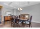 Formal dining area with traditional furniture, coffered ceiling, and stylish light fixture at 5004 Clowser Minnow Ct, Wake Forest, NC 27587