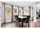A naturally lit dining area features views to the back, wood floors, and neutral décor at 5004 Clowser Minnow Ct, Wake Forest, NC 27587