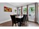 A naturally lit dining area features views to the back, wood floors, and neutral décor at 5004 Clowser Minnow Ct, Wake Forest, NC 27587