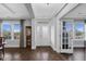Bright foyer with hardwood floors, glass front door, and elegant trim at 5004 Clowser Minnow Ct, Wake Forest, NC 27587