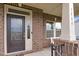 Elegant brick entrance with a decorative front door and well-maintained landscaping at 5004 Clowser Minnow Ct, Wake Forest, NC 27587