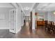 Spacious hallway with dark hardwood floors, neutral walls, and elegant archways at 5004 Clowser Minnow Ct, Wake Forest, NC 27587