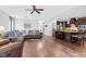 Open concept living room and kitchen with hardwood floors and neutral walls at 5004 Clowser Minnow Ct, Wake Forest, NC 27587