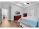 This main bedroom has hardwood floors, tray ceilings and two dressers at 5004 Clowser Minnow Ct, Wake Forest, NC 27587