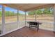 Covered screened in porch with room for entertaining overlooking the back yard at 5004 Clowser Minnow Ct, Wake Forest, NC 27587