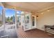 Covered screen porch with a grill, table, and outdoor seating at 5004 Clowser Minnow Ct, Wake Forest, NC 27587