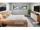 Stylishly decorated bedroom with comfortable bedding, modern furniture, and ample natural light at 5078 Flint Ridge Pl, Raleigh, NC 27609