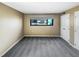 Vacant bedroom with carpet and view of trees from the window at 5078 Flint Ridge Pl, Raleigh, NC 27609