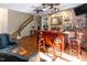 Home bar area with brick accents, custom lighting, bar seating and close proximity to staircase at 5129 Bartons Enclave Ln, Raleigh, NC 27613