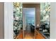 Charming bar area with mirrored shelves, granite countertops, and views to the dining room and outdoor patio at 5129 Bartons Enclave Ln, Raleigh, NC 27613