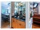 Elegant bar area with glassware display, coffee station, and proximity to the kitchen and dining area at 5129 Bartons Enclave Ln, Raleigh, NC 27613