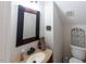 Cozy bathroom with vanity, granite countertop, and decor accents at 5129 Bartons Enclave Ln, Raleigh, NC 27613