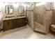A luxurious bathroom featuring a double vanity, and a glass-enclosed walk-in shower with beautiful tile work at 5129 Bartons Enclave Ln, Raleigh, NC 27613
