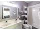 Bathroom featuring a double sink vanity and a bathtub with white tile surround and a striped shower curtain at 5129 Bartons Enclave Ln, Raleigh, NC 27613
