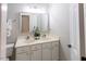 Bright bathroom with double sinks, ample counter space, a well-lit mirror, and a tiled floor at 5129 Bartons Enclave Ln, Raleigh, NC 27613