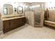 Modern bathroom with double sinks, granite countertops, and tiled walk-in shower at 5129 Bartons Enclave Ln, Raleigh, NC 27613