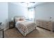 Comfortable bedroom featuring soft carpet, window, and neutral tones at 5129 Bartons Enclave Ln, Raleigh, NC 27613