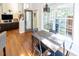 Bright breakfast nook featuring hardwood floors, a modern light fixture, and lots of natural light at 5129 Bartons Enclave Ln, Raleigh, NC 27613