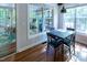 Inviting breakfast nook with hardwood floors, surrounded by windows offering an abundance of natural light at 5129 Bartons Enclave Ln, Raleigh, NC 27613